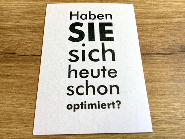 Postkarte mit dem Text "Haben Sie sich heute schon optimiert?"